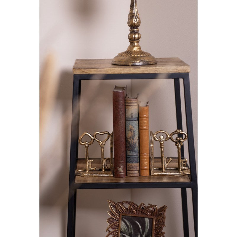 Decorative gold-colored iron bookends with keys