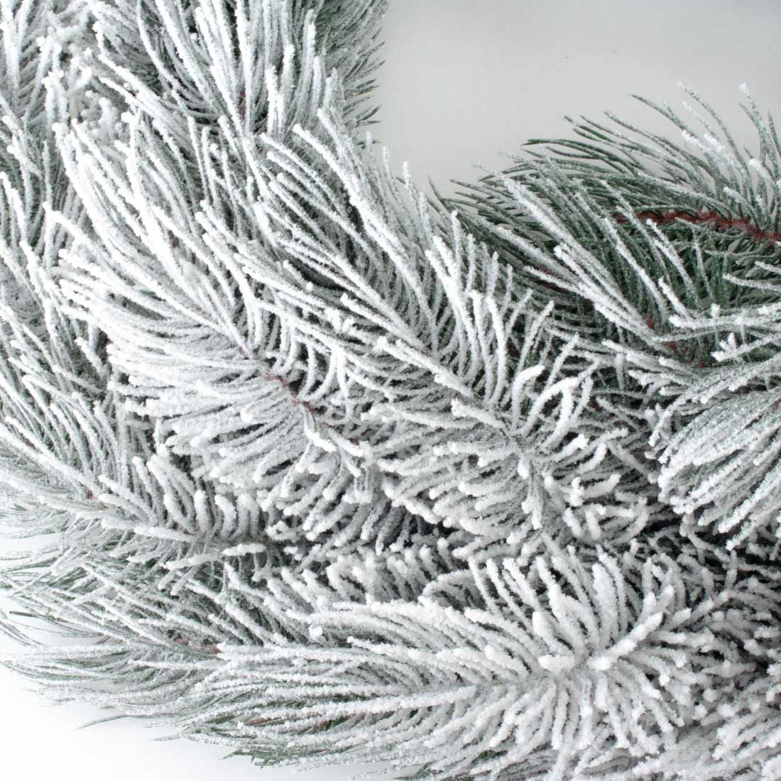 Christmas wreath cast Snow-covered pine plastic